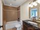 Bathroom features a tile surround tub and elegant vanity with updated fixtures at 8904 Woodhall Lake Dr, Waxhaw, NC 28173