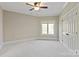 Bedroom with neutral carpet, one window, and a ceiling fan at 8904 Woodhall Lake Dr, Waxhaw, NC 28173