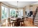 Dining area with lots of sunlight and wooden furniture at 8904 Woodhall Lake Dr, Waxhaw, NC 28173