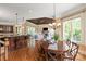 Bright dining area near the kitchen with a wood table and a backyard view at 8904 Woodhall Lake Dr, Waxhaw, NC 28173