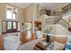 Grand foyer with soaring ceilings, a striking staircase, and beautiful hardwood floors at 8904 Woodhall Lake Dr, Waxhaw, NC 28173