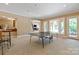 Finished basement game room features a bar and walkout access to the yard at 8904 Woodhall Lake Dr, Waxhaw, NC 28173
