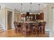 Kitchen island with granite countertops, barstool seating, and pendant lighting at 8904 Woodhall Lake Dr, Waxhaw, NC 28173