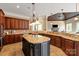 Large kitchen with granite countertops, custom cabinetry, and an island at 8904 Woodhall Lake Dr, Waxhaw, NC 28173