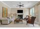 Living room with large fireplace, neutral decor, carpeted floors and plenty of space for furniture at 8904 Woodhall Lake Dr, Waxhaw, NC 28173
