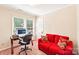 Cozy room with a desk area, large window and a comfortable sitting space at 11701 Brockley Ct, Charlotte, NC 28215