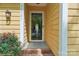 Inviting front porch with a glass door and brick steps, enhancing curb appeal at 11701 Brockley Ct, Charlotte, NC 28215