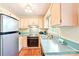 Well-lit kitchen with ample cabinet space and essential appliances at 11701 Brockley Ct, Charlotte, NC 28215