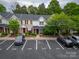 Aerial shot of townhouses with ample parking; well-maintained landscaping and mature trees surround the properties at 118 Barnhardt Loop, Mooresville, NC 28117