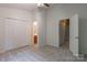 Well-lit bedroom featuring a ceiling fan and double door closets at 118 Barnhardt Loop, Mooresville, NC 28117