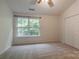 Comfortable bedroom with a large window and double door closet at 118 Barnhardt Loop, Mooresville, NC 28117