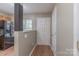 Inviting entryway with wood-look flooring, neutral paint, and a view into the kitchen area at 118 Barnhardt Loop, Mooresville, NC 28117