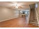 Inviting living room with hardwood floors, breakfast bar, and staircase at 118 Barnhardt Loop, Mooresville, NC 28117