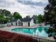 Community pool surrounded by white fencing and lush greenery at 118 Barnhardt Loop, Mooresville, NC 28117