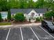Charming pool house with black roof, white trim, and a convenient parking area at 118 Barnhardt Loop, Mooresville, NC 28117