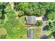 Aerial view of the property with trees, highlighted property lines, and well-maintained landscaping at 1209 Leigh Ave, Charlotte, NC 28205