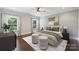 Bright bedroom with neutral tones, ensuite bathroom, and large windows with backyard views at 1209 Leigh Ave, Charlotte, NC 28205