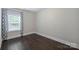 Bedroom with wood floor and a window offering an abundance of natural light at 1209 Leigh Ave, Charlotte, NC 28205