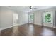 Spacious primary bedroom with hardwood floors, neutral walls, and plenty of natural light at 1209 Leigh Ave, Charlotte, NC 28205