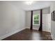 Neutral bedroom with wood floors and a window offering an abundance of natural light at 1209 Leigh Ave, Charlotte, NC 28205
