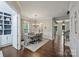 Elegant dining room with hardwood floors, modern chandelier, and views to other rooms at 1209 Leigh Ave, Charlotte, NC 28205