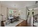Elegant dining room with a farmhouse table, hardwood floors, and plenty of natural light at 1209 Leigh Ave, Charlotte, NC 28205