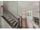 Welcoming entryway with hardwood floors, staircase, and view of the living spaces at 1209 Leigh Ave, Charlotte, NC 28205