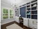 Bright home office featuring built-in bookshelves, desk, and large window for natural light at 1209 Leigh Ave, Charlotte, NC 28205
