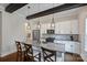 Modern kitchen featuring an island with granite countertops, stainless appliances, and custom cabinetry at 1209 Leigh Ave, Charlotte, NC 28205