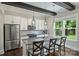 Modern kitchen featuring an island with granite countertops, stainless appliances, and custom cabinetry at 1209 Leigh Ave, Charlotte, NC 28205