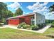 Cordelia Park Pavilion with red siding, large windows, and beautiful landscaping at 1209 Leigh Ave, Charlotte, NC 28205