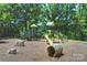 Outdoor playground area with slides, climbing structures, and natural surroundings at 1209 Leigh Ave, Charlotte, NC 28205