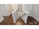 Hardwood staircase with white railing and walls leading to an upper level at 1209 Leigh Ave, Charlotte, NC 28205