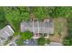 Aerial view of the townhome featuring mature landscaping and multiple parking spaces at 13660 Meade Glen Ct, Charlotte, NC 28273