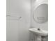 Clean bathroom with a pedestal sink and modern fixtures at 13660 Meade Glen Ct, Charlotte, NC 28273