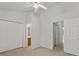 Bedroom with neutral walls and carpet, has a ceiling fan and ample closet space at 13660 Meade Glen Ct, Charlotte, NC 28273