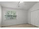 Neutral bedroom featuring a window and closet at 13660 Meade Glen Ct, Charlotte, NC 28273
