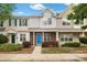 Charming townhome featuring a bright blue front door and well-maintained landscaping at 13660 Meade Glen Ct, Charlotte, NC 28273