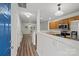 View of the kitchen with stainless appliances and wood cabinets from the front entryway at 13660 Meade Glen Ct, Charlotte, NC 28273