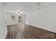 Bright living room featuring wood floors and access to the backyard at 13660 Meade Glen Ct, Charlotte, NC 28273