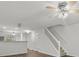 Living room with ceiling fan and open floor plan, leading to the staircase at 13660 Meade Glen Ct, Charlotte, NC 28273