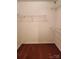 Walk-in closet featuring shelving and a hardwood floor, ready for customization and storage at 14343 Arbor Ridge Dr, Charlotte, NC 28273