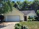 Charming home with a two-car garage, mature trees, and well-maintained landscaping at 14343 Arbor Ridge Dr, Charlotte, NC 28273