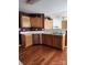 Kitchen featuring stainless steel appliances, light oak cabinets, and hardwood floors at 14343 Arbor Ridge Dr, Charlotte, NC 28273