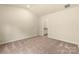 Neutral bedroom with carpet and open doorway to bathroom at 1528 Doran Ter, Richburg, SC 29729