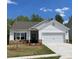 Charming one-story home featuring white siding, stone accents, and a two-car garage in a desirable neighborhood at 1532 Doran Ter, Richburg, SC 29729