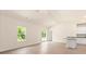 Bright open-concept living room with luxury vinyl plank flooring, a ceiling fan and sliding doors to the backyard at 1532 Doran Ter, Richburg, SC 29729