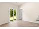 Bright living room features sliding glass doors leading to the backyard and luxury vinyl plank flooring at 1532 Doran Ter, Richburg, SC 29729