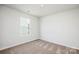 Spare bedroom featuring carpet and a window for natural light at 1538 Doran Ter, Richburg, SC 29729