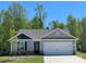 Charming single-story home featuring a two-car garage and a beautifully landscaped front yard at 1538 Doran Ter, Richburg, SC 29729